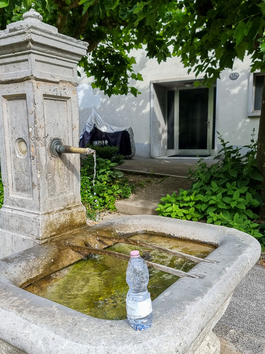 Bottle in Lucerne in front of one of the million free, delicious water fountains of Europe.