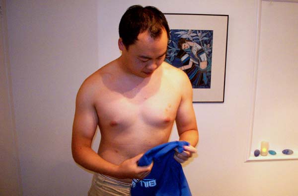 Chow prepares for his waxing with Elise. He claims the bruise on his left breast was from an errant nipple cripple.