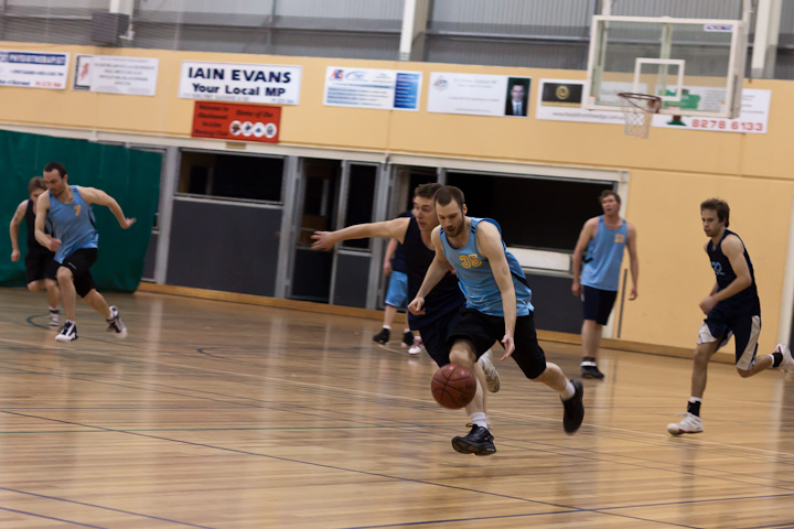 TBA (in light blue).

Scott dribbling the ball at a fast pace towards the basket.
